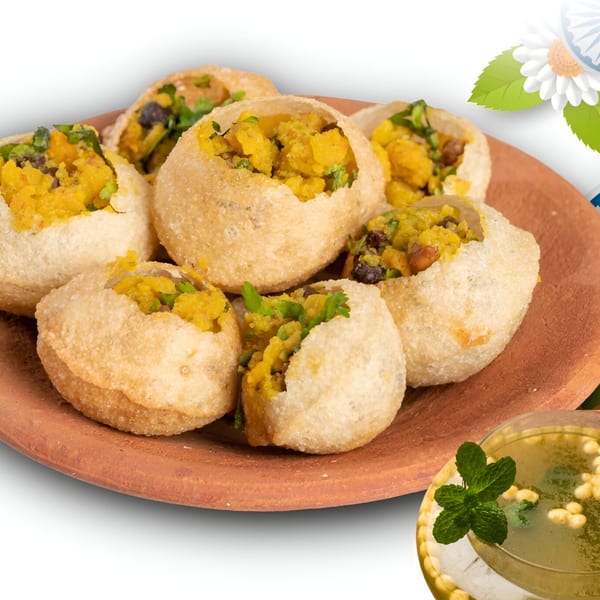 A terracotta plate filled with golden-brown pani puri, stuffed with yellow potato and chickpea filling.